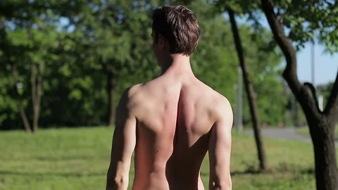 The guy is posing in nature. Video stock 76255558