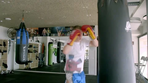 Guy is practicing blows. In the boxing gym, kickboxing Stock Footage 141185076
