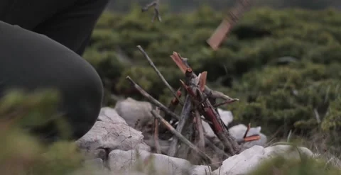 The guy prepares the fire. Firewood preparation. Stock Footage 166399031