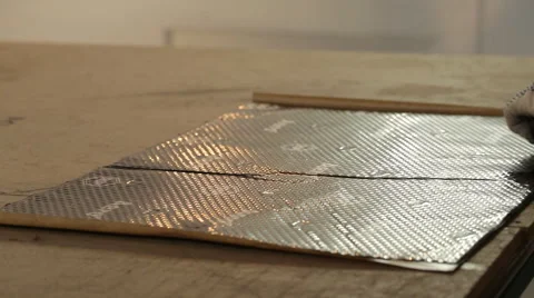 The guy is preparing material for soundproofing Stock Footage 56024325