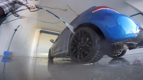 Guy pressure washes his nice car Stock Footage 56566738
