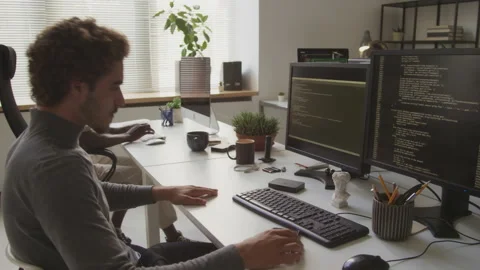 Guy Program Coding on Computer in Office Stock Footage 255782279