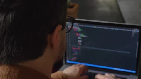 Guy programmer writes code on a computer at home Stock Footage 150456491