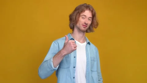 Guy promote himself make thumb up symbol isolated bright color background Stock Footage 169277039