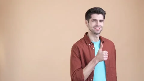 Guy promoter point empty space share ads isolated pastel color background Stock Footage 169936872