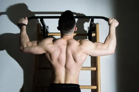 The guy pulled on the bar Stock Photos