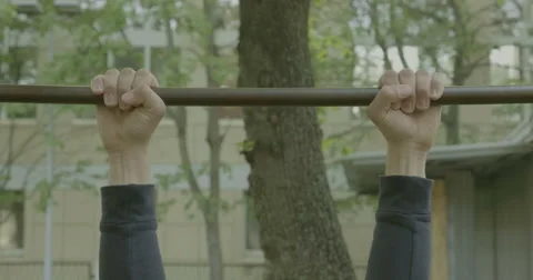 The guy pulled on the bar on the street Stock Footage 63938438