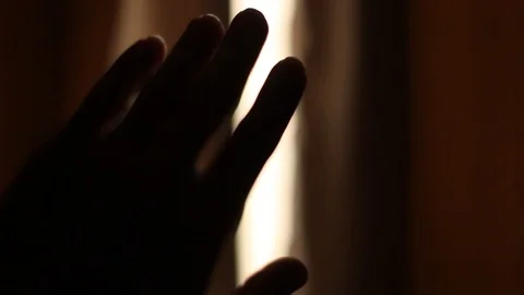 Guy pulls back the curtain to see the sky. Hand closeup Stock Footage 121951952