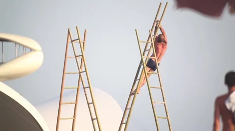 The guy pulls himself up on the horizontal bar. turnstile. athlete on the beach. Stock Footage 45795700