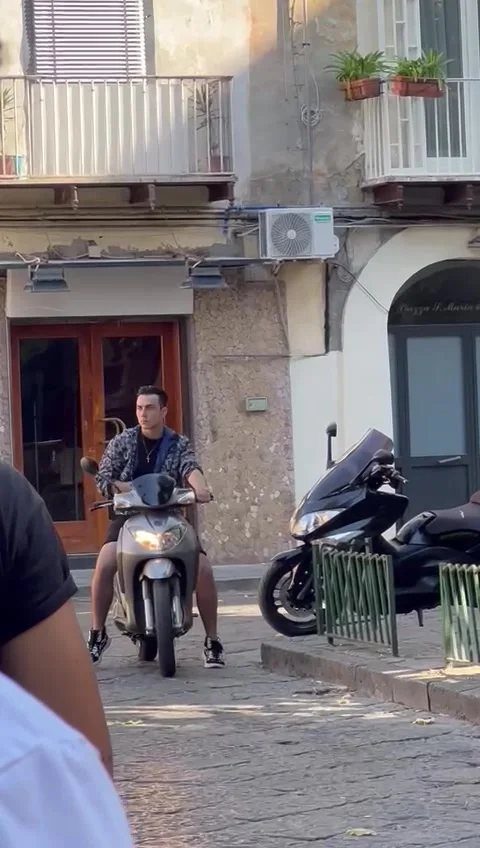 Guy Pulls up on Moped and Fires Handgun for Netflix Show, Naples - 31 Aug 2022 Stock Footage 220291127