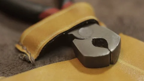 Guy pulls out pliers from the set 스톡 동영상 81985484