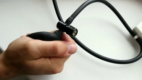 Guy is pumping air to measure pressure Video stock 80358366