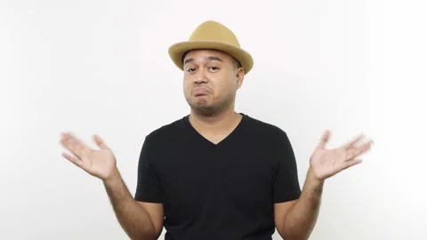 Guy put on hat in casual clothes expressing no and don't care gestures by shrugg Stock Footage 144651384