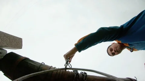 The guy puts a bucket on a chain at the bottom of the well for water intake. Stock Footage 113754566