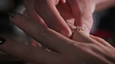 Guy Puts an Engagement Ring to His Bride Stock Footage 255539702
