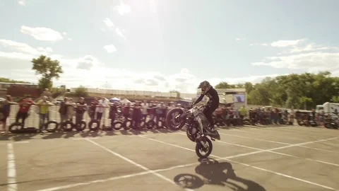 The Guy Puts His Foot on the Wing of a Motorcycle Stock Footage 78338864