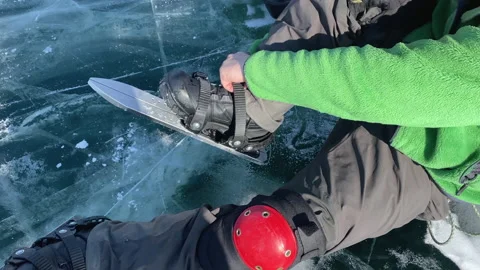 A guy puts on skates to skate on ice Stock-Footage 151063824