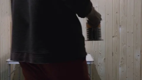 The guy puts on the table a teapot, mug and a jar of sugar Stock Footage 119526156