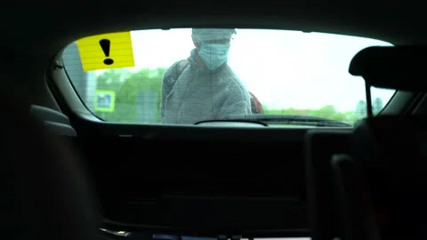 The guy puts things in the trunk of the car Stock Footage 130877803