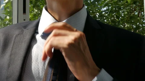 The guy puts on a tie Stock Footage 66554855