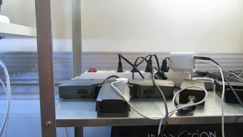 Guy putting a charger to outlet. Stock Footage 99466511