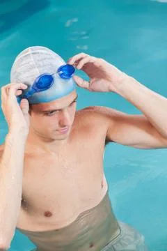 Guy putting on goggles Stock Photos