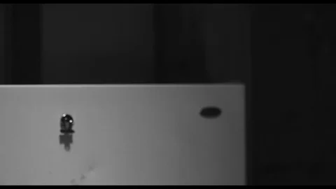 Guy putting a note on the fridge and making a call Stock Footage 90270898