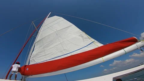 Guy putting up the sail 2 Video stock 288233655