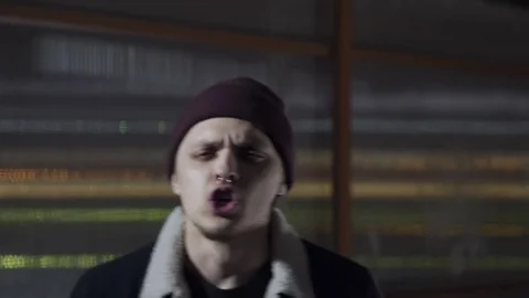 Guy is rapping and looking at the camera Stock Footage 80480770