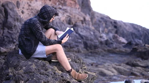 A guy reading a book Stock Footage 58113807