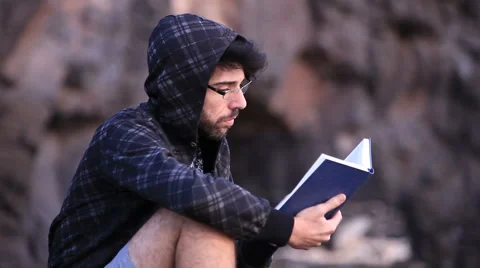 A guy reading a book 動画素材 58116075