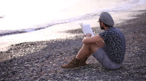 A guy reading a book Stock Footage 58254981