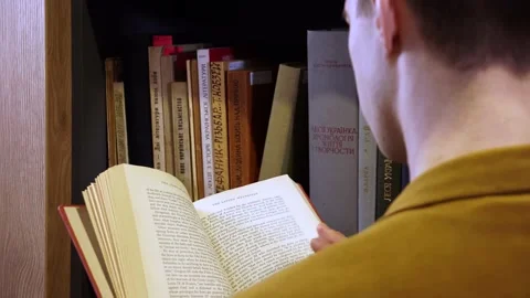 The guy reads a book Stock Footage 155963155