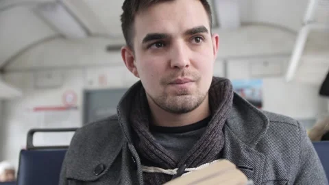  Guy Reads a Book Rides a Train Stock Footage 144635706
