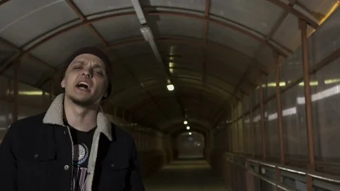 Guy reads rap and walks Stock Footage 80480312