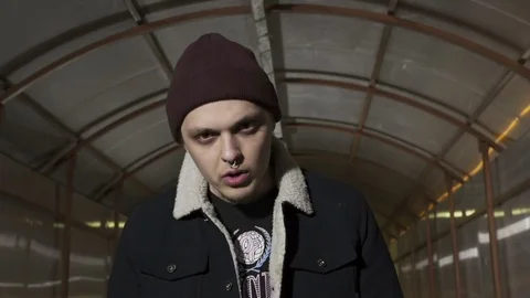 Guy reads rap with his head down Stock Footage 80479984