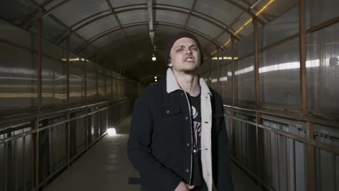 Guy reads rap looking at camera Stock Footage 80467656