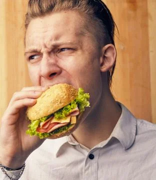 Guy is really trying to burger Stock Photos