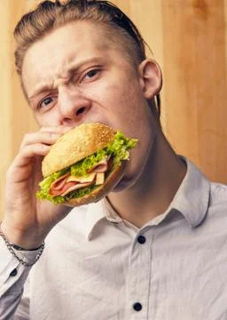 Guy is really trying to burger Stock Photos