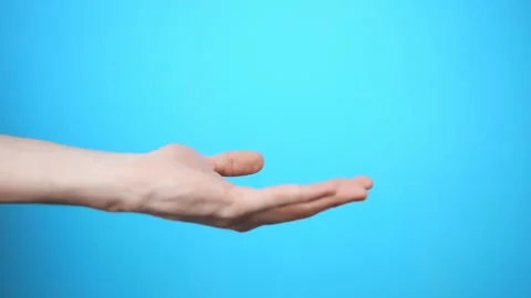 The guy receives a parcel on a blue background. Made Stockbeeldmateriaal 150332021