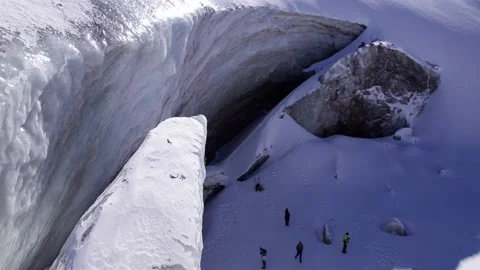 The guy in red is standing on top of the glacier. Video stock 233875215