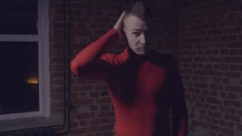 Guy in red sweater posing Video stock 104097534