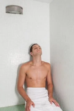 Guy relaxed inside the sauna Stock Photos