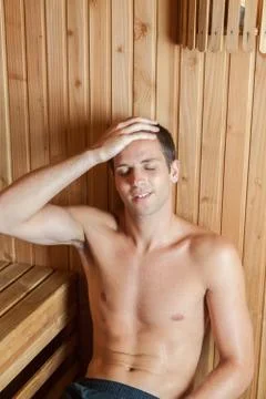Guy relaxed inside the sauna 写真素材