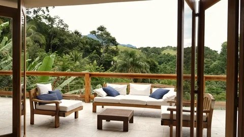 Guy relaxing on balcony 스톡 동영상 94019650