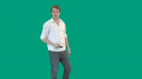 Guy with remote control - green screen - pre keyed - MINT.GS Video stock 11344229