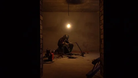 The guy restores a motorcycle. Work in the garage Stock Footage 124360767