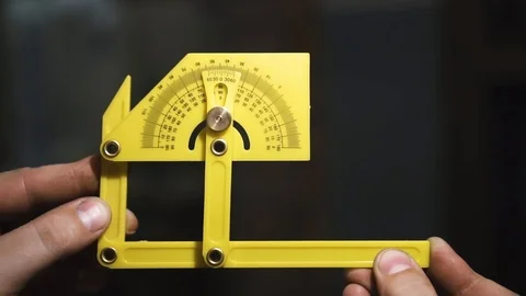 The guy reveals a measuring building ruler in garage 動画素材 108501183