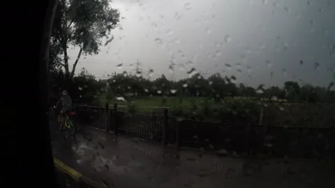 The guy rides the bus on a rainy day and shoots on camera himself and the Stock Footage 130174931