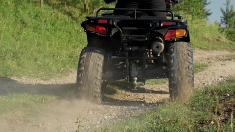 The guy rides very fast on a quad motorcycle Stock Footage 291724988